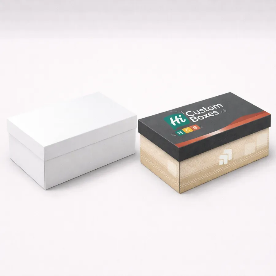 A plain white box next to a premium branded box with a dark grey lid- class=